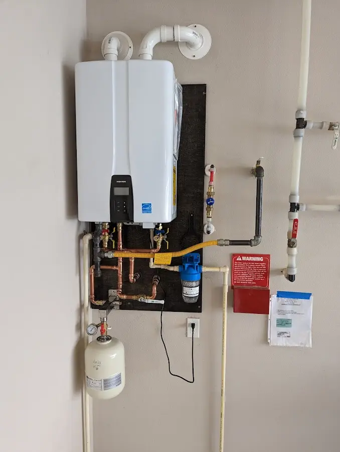 Professional plumber installing copper piping in a Milliken home